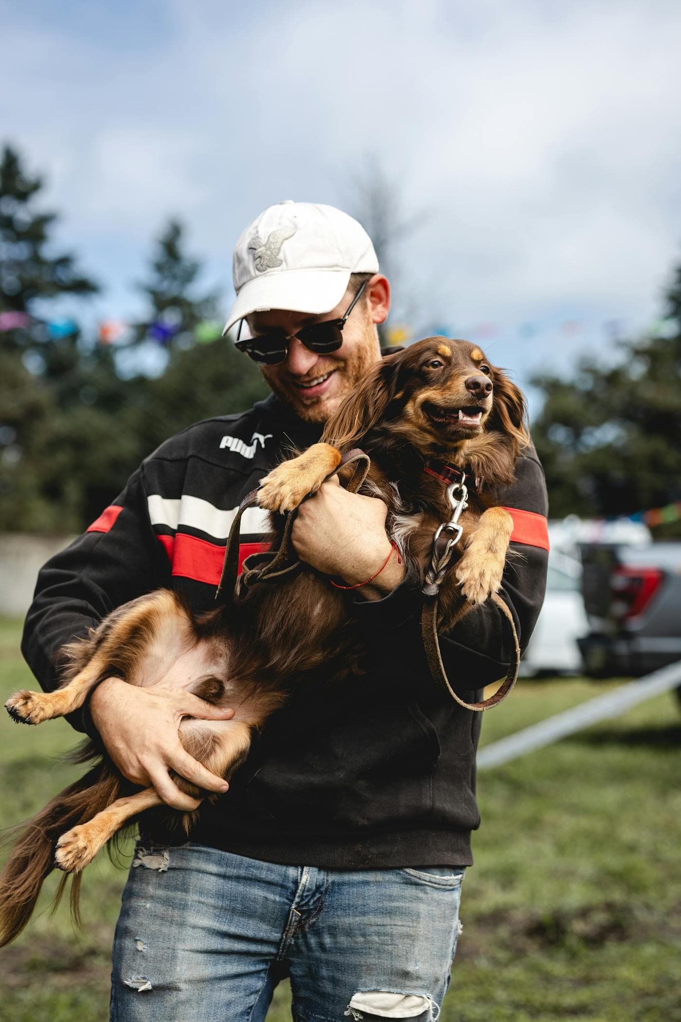 A pet owner with their dog at a community event